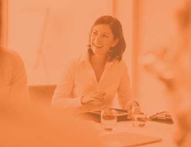 Man in suit with scales of justice on top of a book
